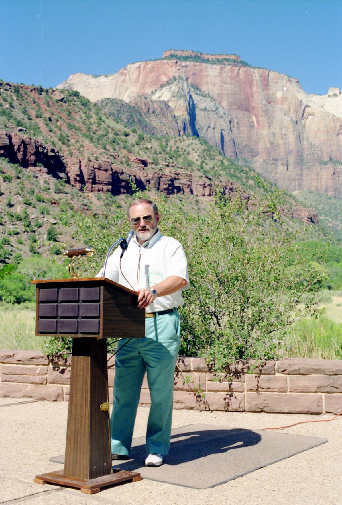 Color Photos of the parks 72nd anniversary celebrations- cake cutting, barbecue, speakers.