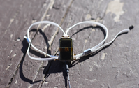 a small electronic device attached to a sort of zip-tie thing