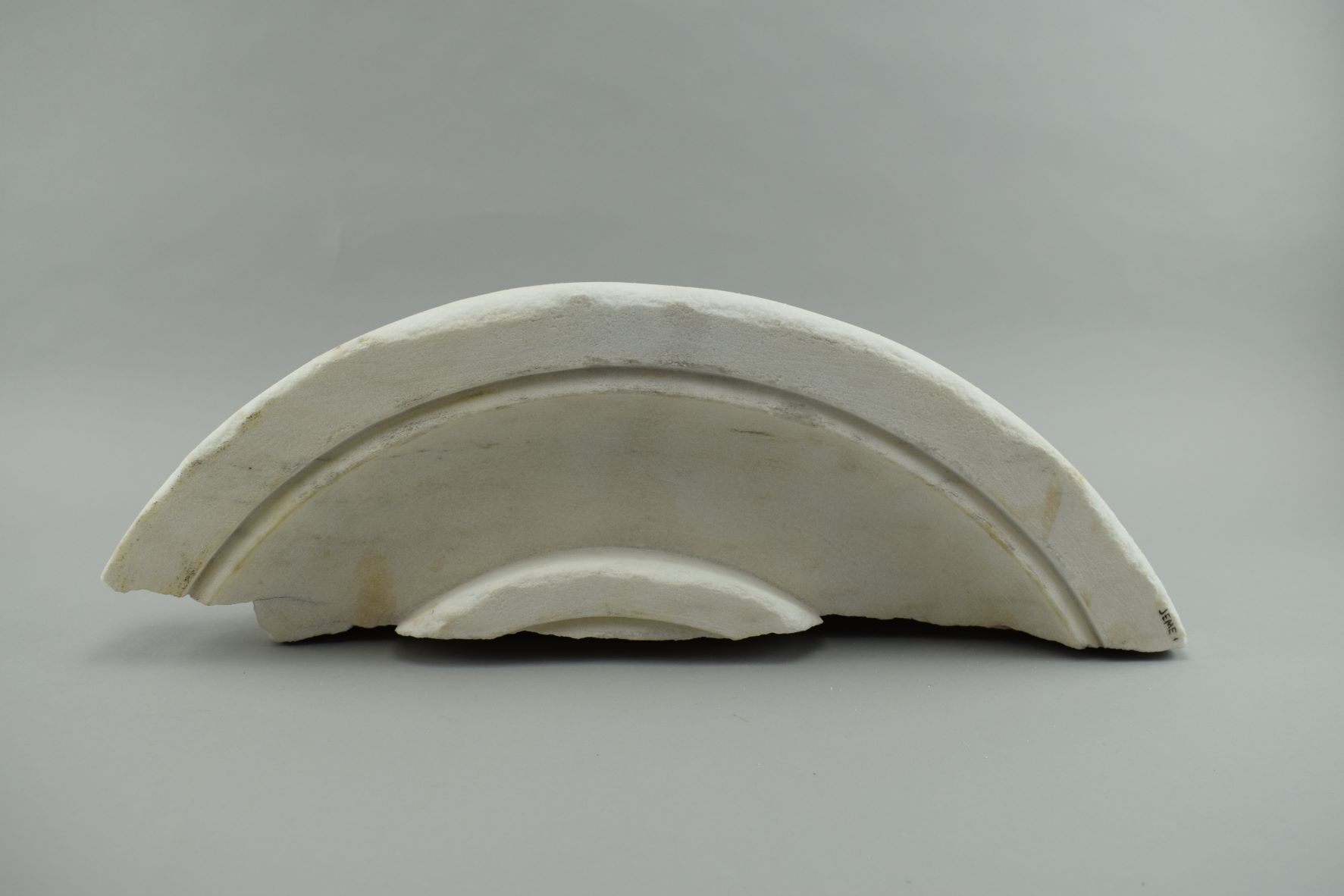 Semi-circular piece of marble volute of a column