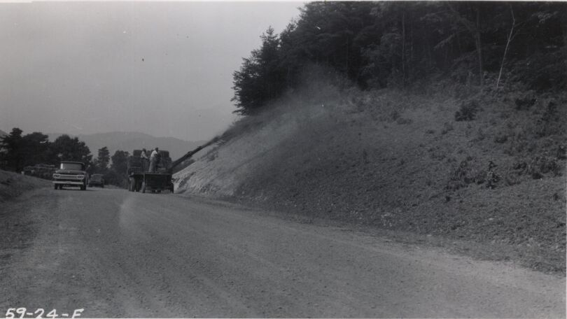 Mulching at Station 302, also showing rough graded roadway with base stone in place