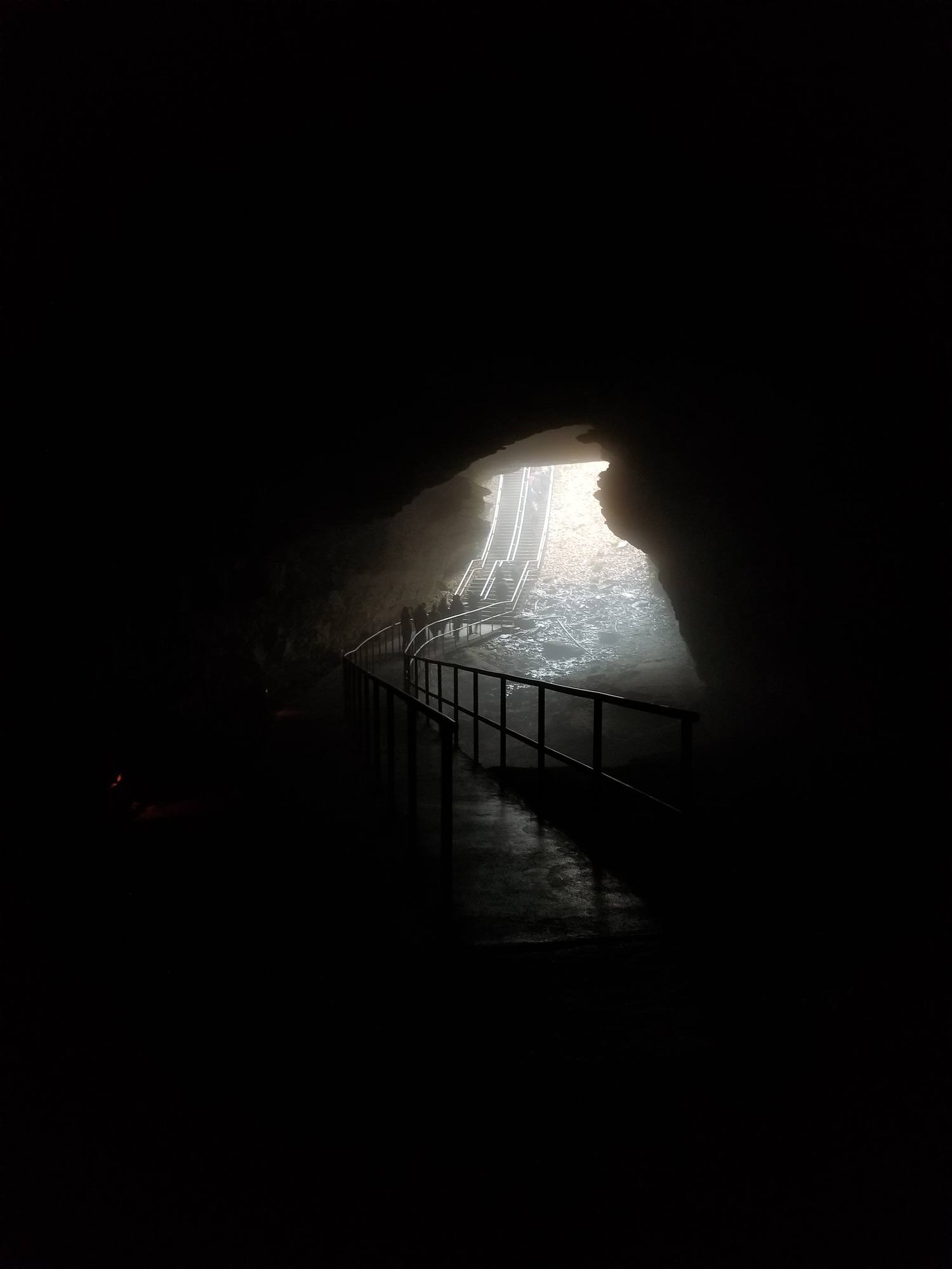 Looking out of the cave to see fog on the surface.