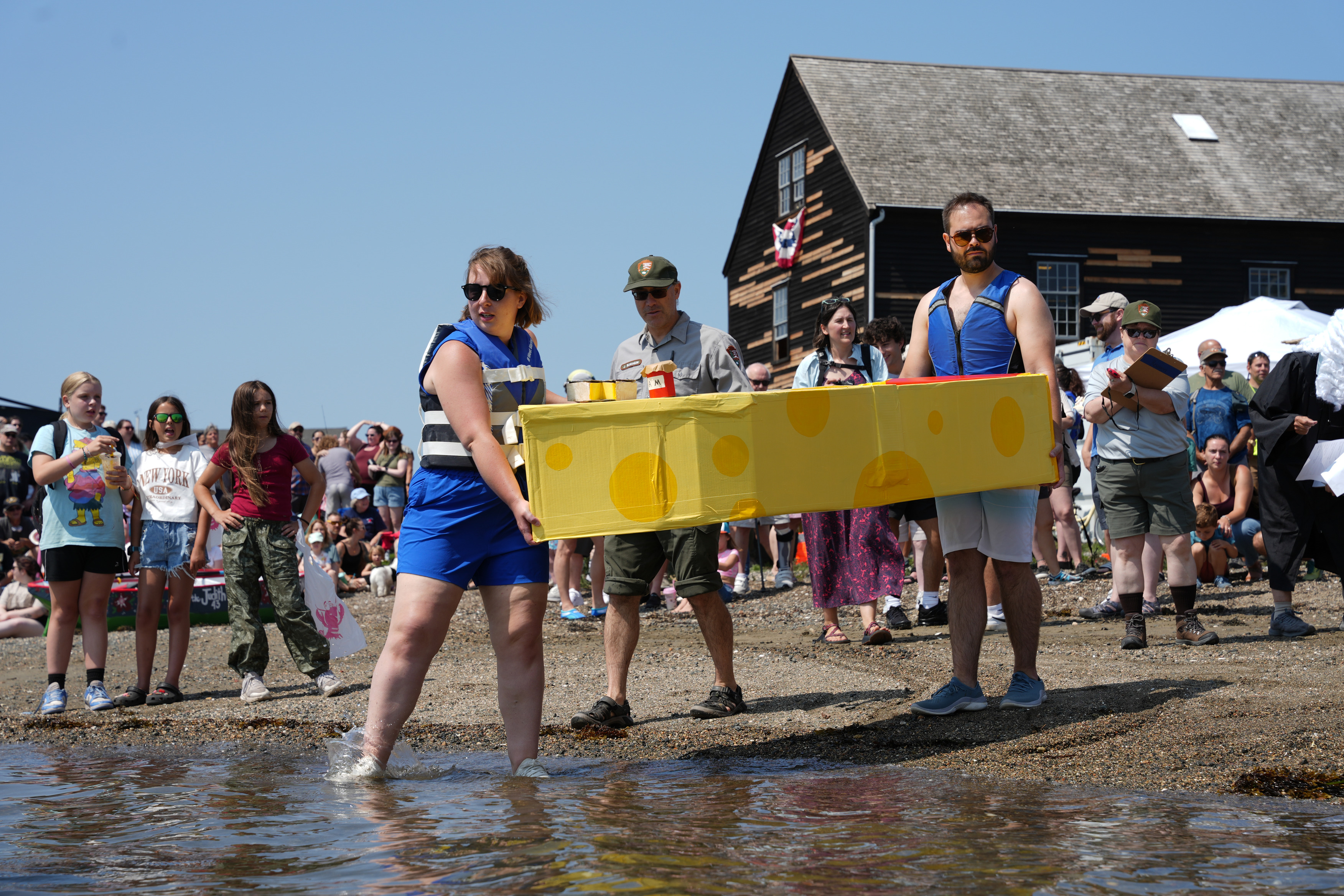 Cardboard boats prepare to race in Salem Harbor.
