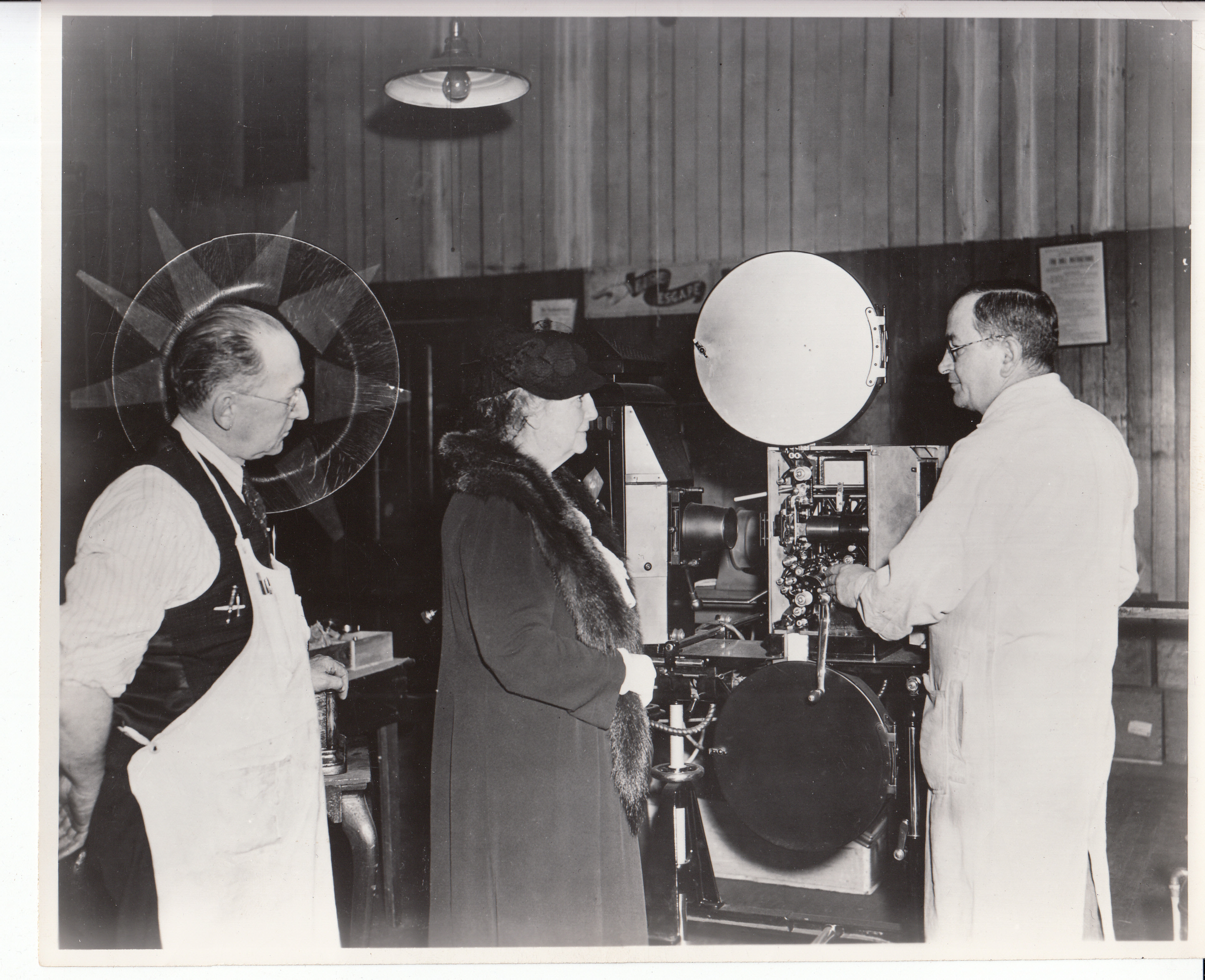 William Hayes, Mina Edison, and Joseph Ziemba examining a Kinetoscope projector on the third floor of Building 5.