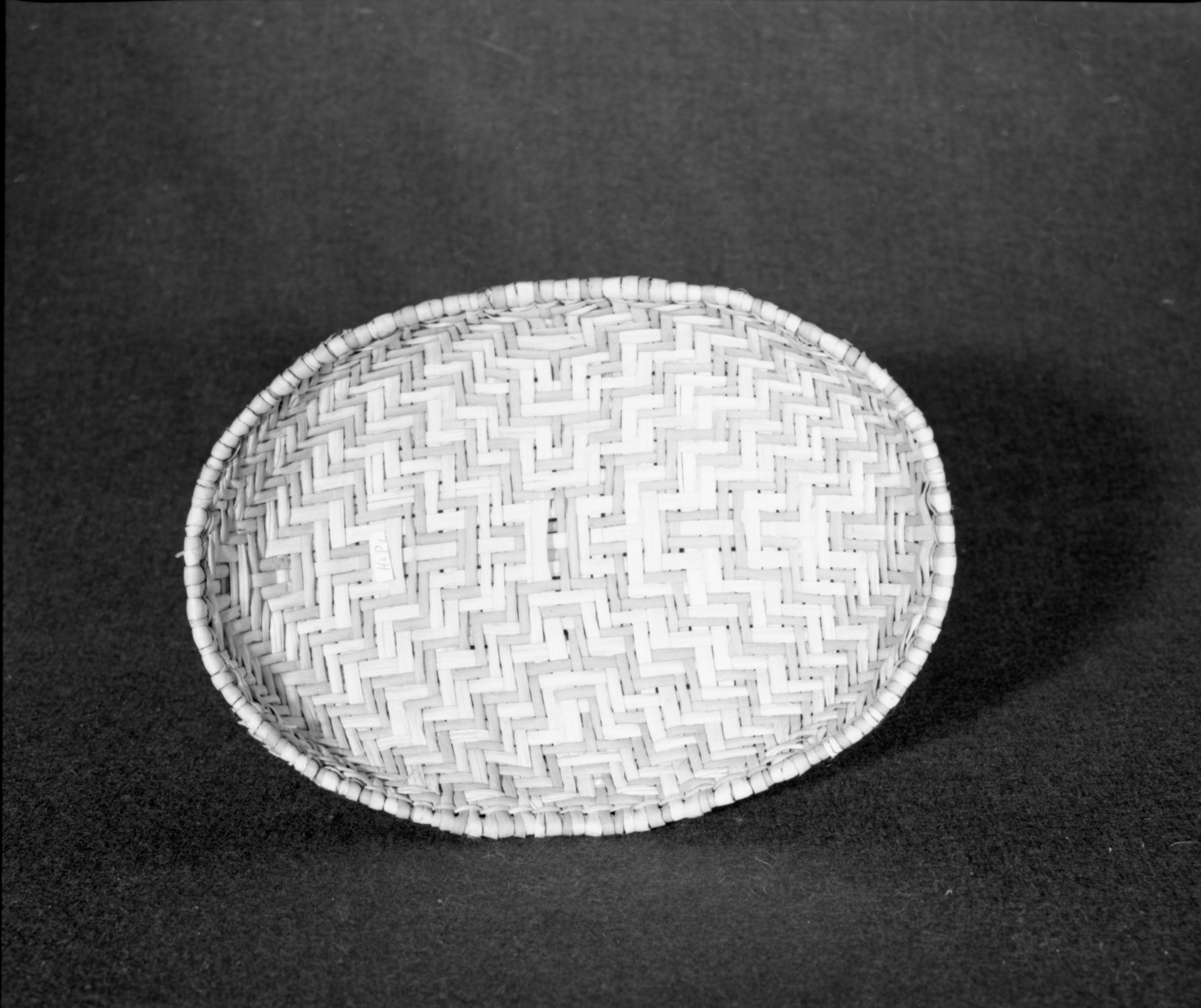 Marie Rozier Collection, Catalog No. 271. Object: Hopi winnower. Dimensions: 11 x 2". Materials: Yucca. Technology: Entirely plaited. Collection History: Gift of Craig Bates, made ca. 1969. Photographed by Michael Dixon in December 1982. Catalogued by Craig Bates and Barbara Beroza. Yosemite Collections, National Park Service.