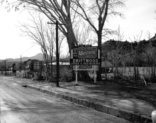 Roadside signs in Springdale. Driftwood Lodge and Restaurant 'Best Western Motel'