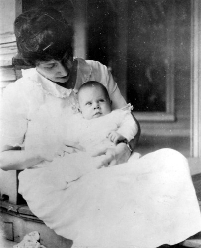 Woman holding baby. Bess Truman holding Margaret.