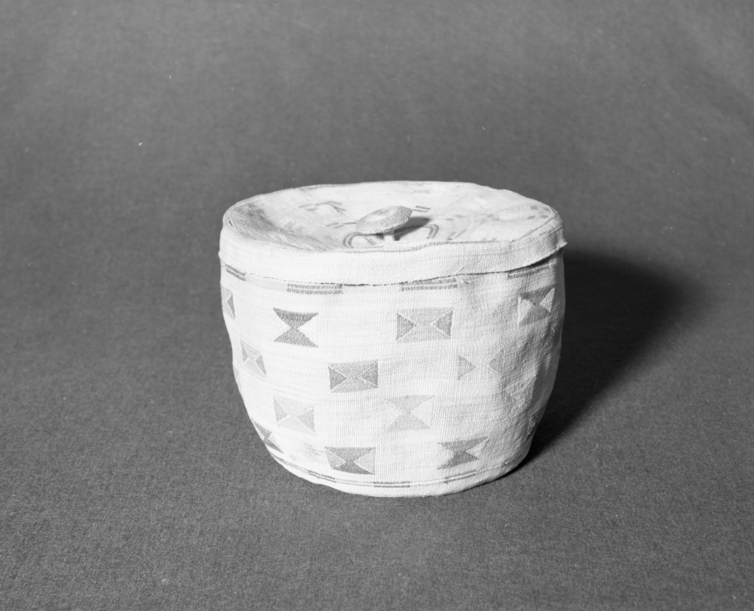 Marie Rozier Collection, Catalog No. 5-3. Object: Aleut basket. Dimensions: 11" x 7". Materials: seagrass, wool yarn. Technology: down to right slant of turns. Collection History: Gift of Flora Hill McCullough. Photographed by Michael Dixon, December 1982. Catalogued by Craig Bates and Barbara Beroza. Yosemite Collections, National Park Service.