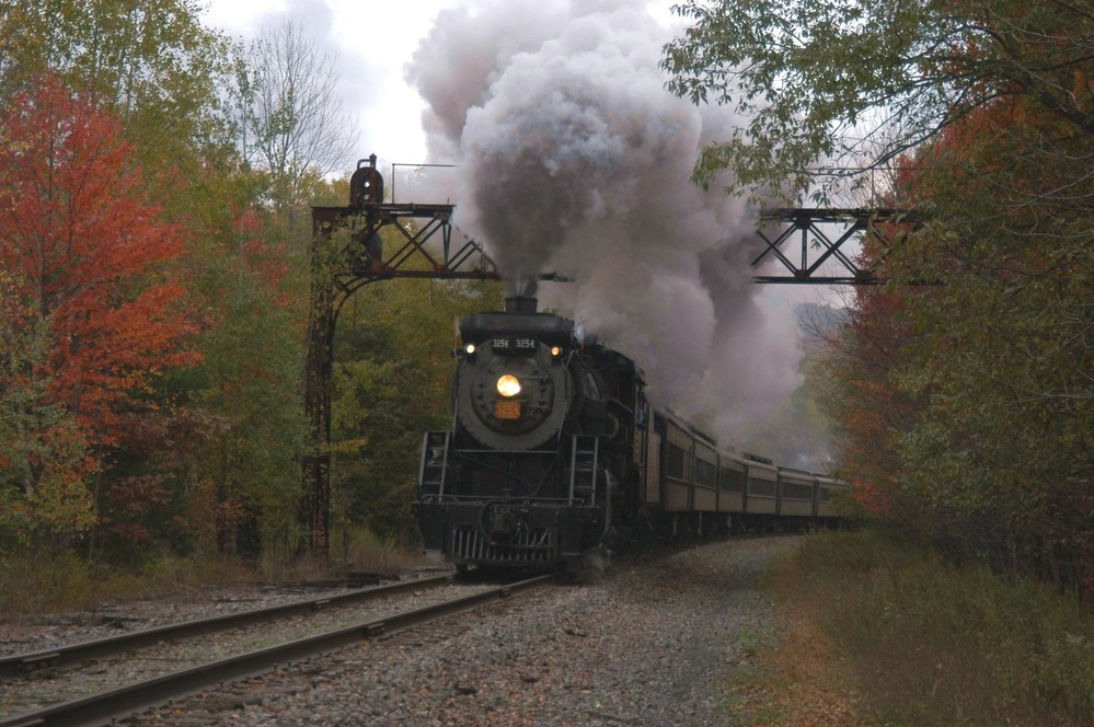 Canadian National 3254, built in 1917, blasts under on of the DL&W's historic signal bridges. These signals allowed trains to follow each other very closely using green (full speed), yellow (be prepared to stop) and red (stop) signals.