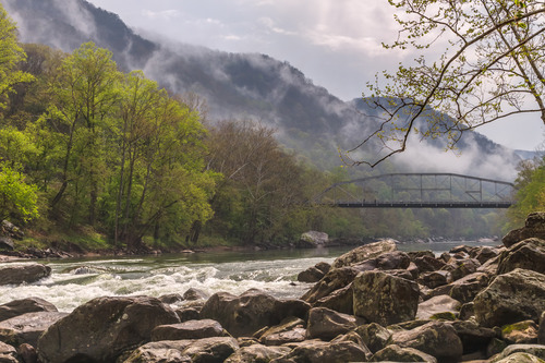 bridge over the river with clouds