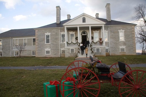 A view of the front of Belle Grove, with a sleigh decorated for Christmas.