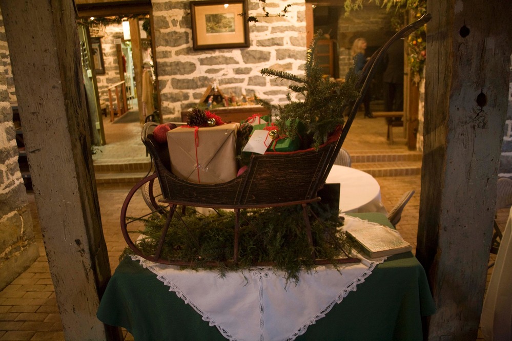 A miniature sleigh is decorated for Christmas, and makes for a delightful holiday touch inside the Belle Grove Manor House.