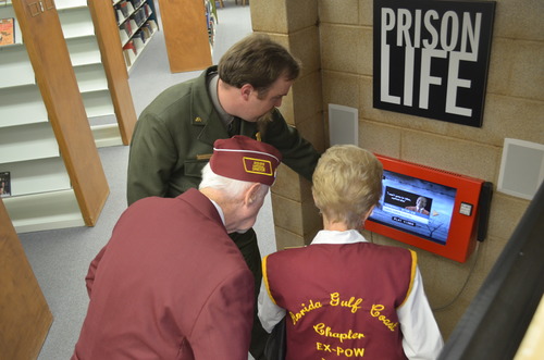 Park ranger and visitors use interactive display