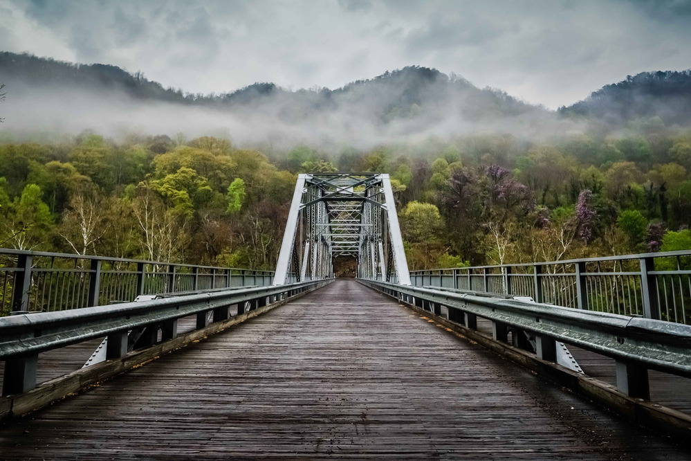 view across bridge with clouds overhead