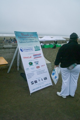 Opening day for the California Coastal Cleanup 2008. A visitor waits to signup and help clean up Ocean Beach.