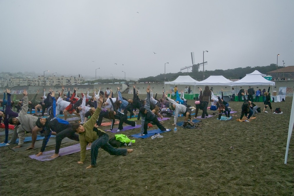 Morning yoga begins for some of the volunteers of the California Coastal Cleanup to help them limber up for the event.