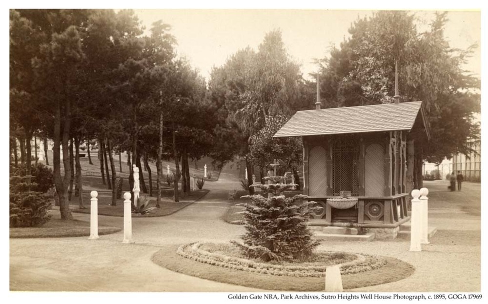 Well house at Sutro Heights Park with Norfolk Island Tree in front, 1895.