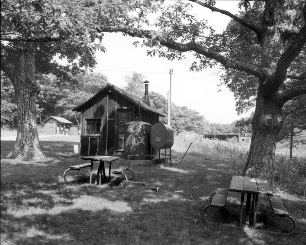 VA-119-12	PINEY RIVER RANGER STATION. VIEW OF OLD CCC CAMP GAS STORAGE BUILDING, LOOKING TO SOUTH. PICNIC TABLES IN FRONT.  More about HAER Photo Documentation...
