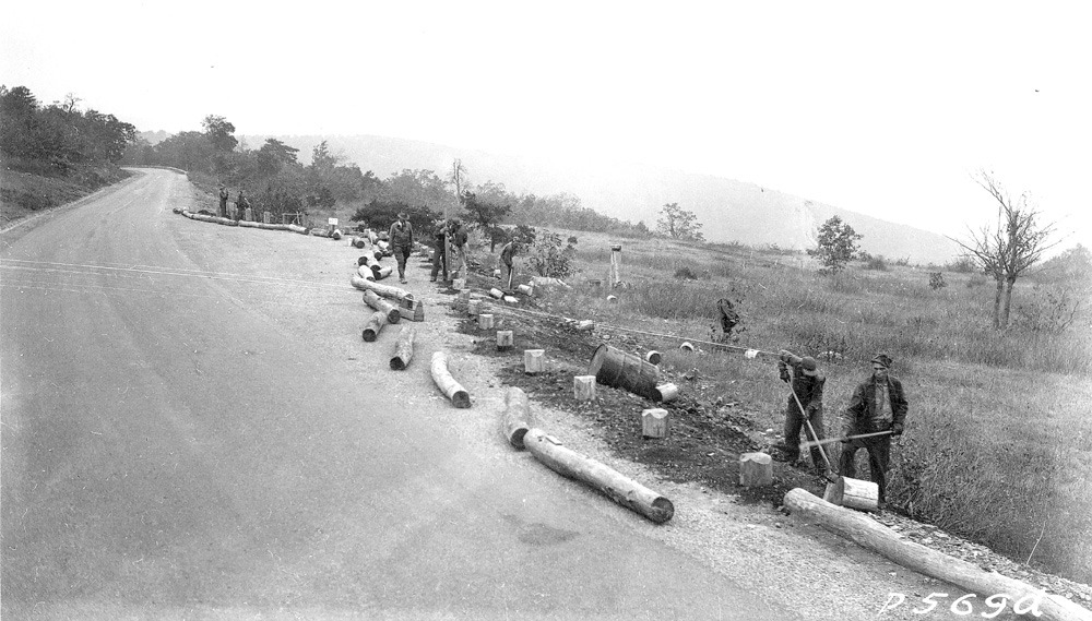 Construction of Old Rag View Overlook by CCC. CCC using chestnut logs to make log guide rail.
