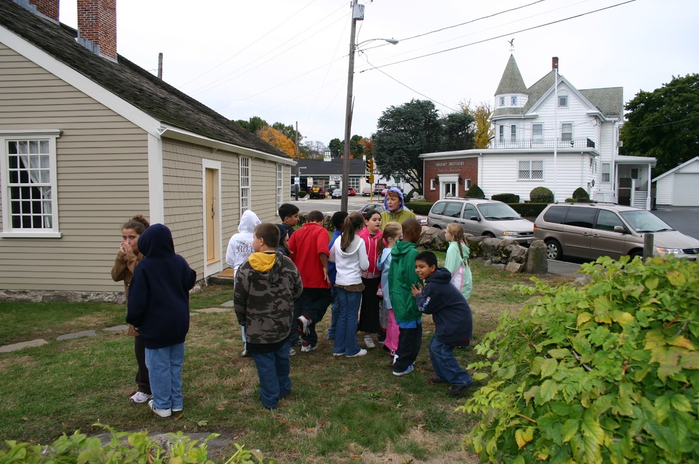 Students from nearby Lincoln Hancock school gather to greet the wedding party