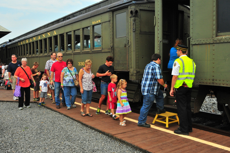 Visitors boarding excursion coaches