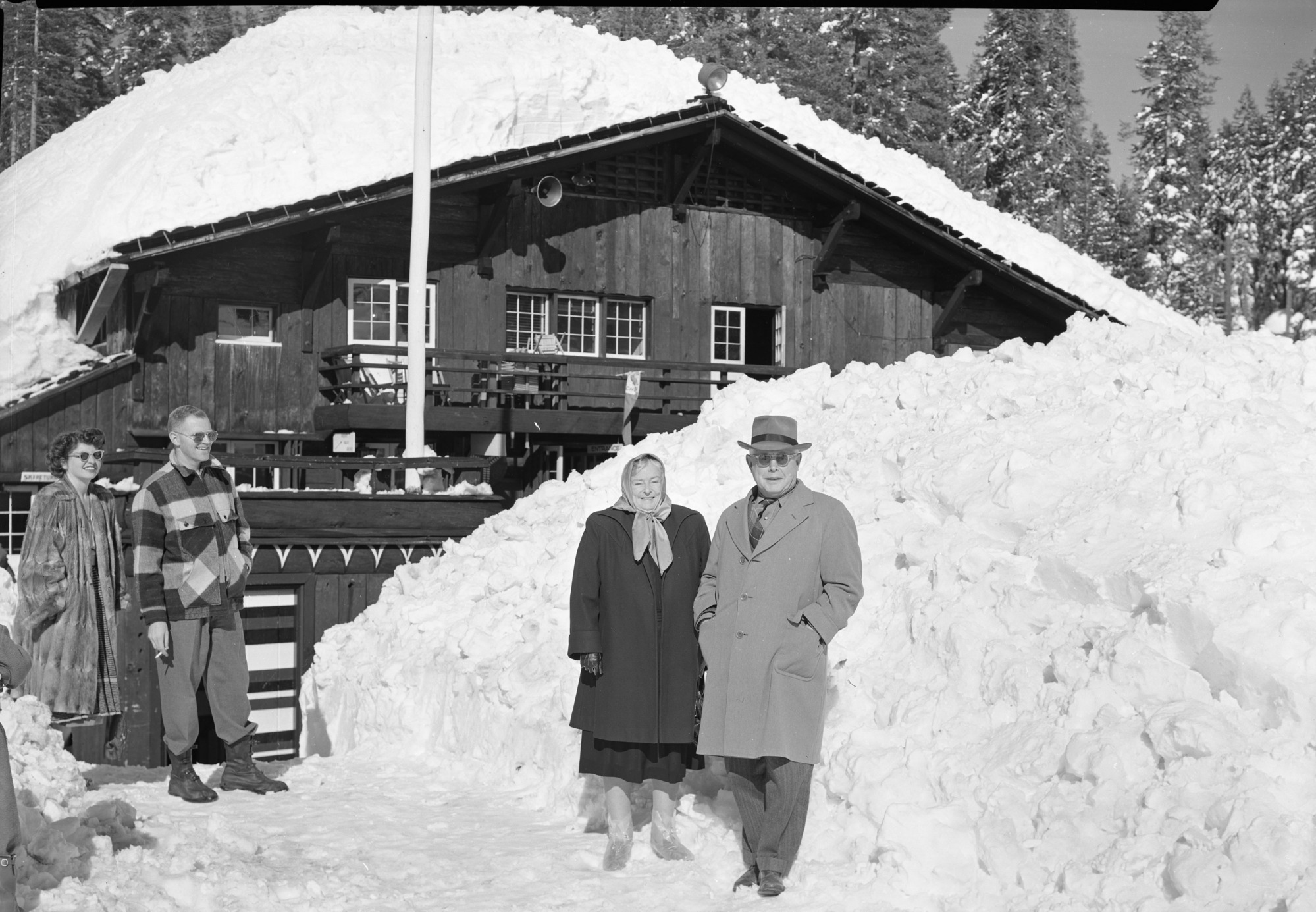 After record snowfall. In pictures are Mr. and Mrs. Arthur Demaray, recently retired Director of NPS; Mr. and Mrs. Wesley, landscape engineer of Region Four.