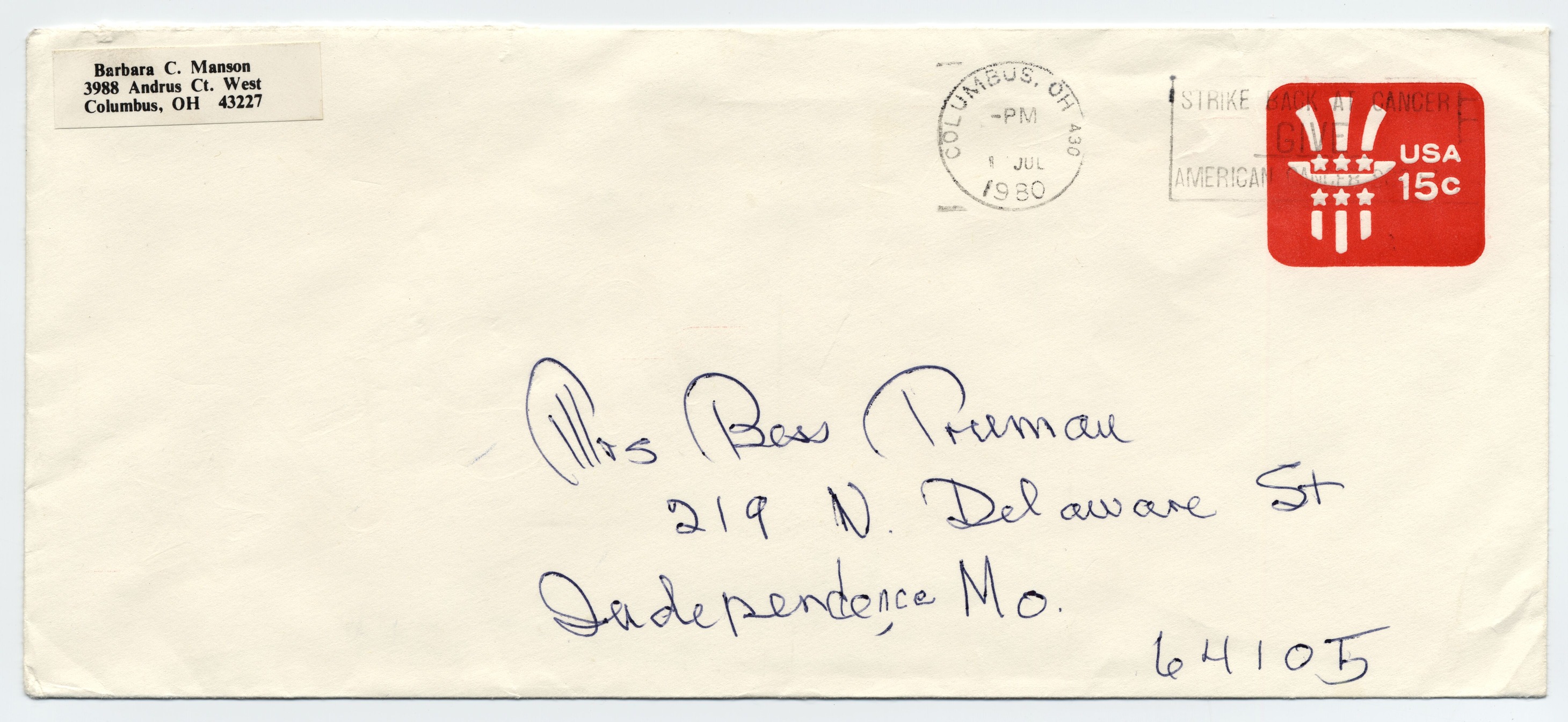 An envelope with a note on the back in blue pen.