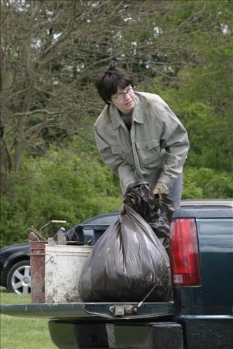 RiverDay trash clean up staff and volunteers at dumpster
