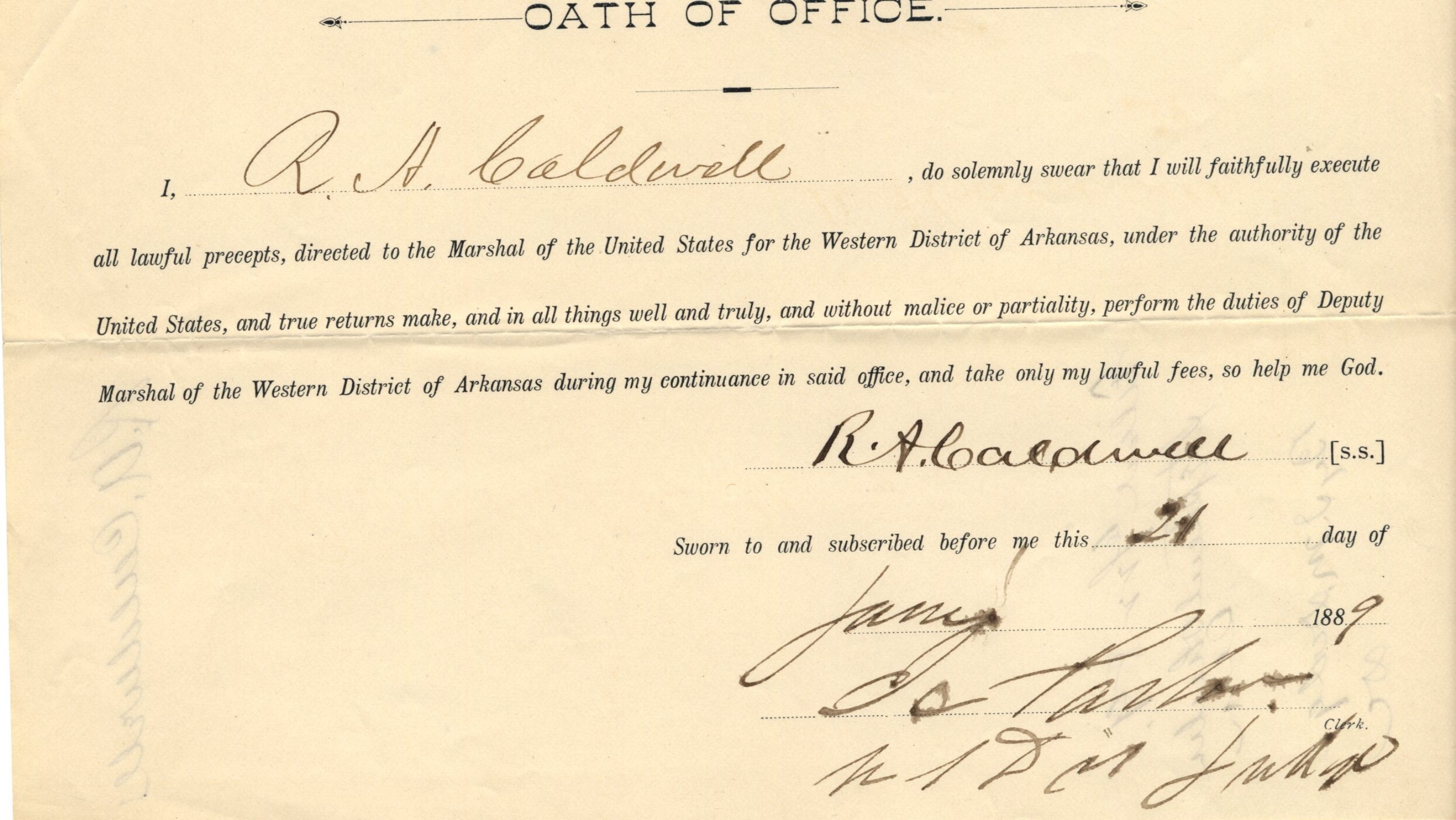 An aged slip of paper titled, "Oath of Office," with the signature of R. A. Caldwell dated June 24, 1889. Text reads: “I do solemnly swear that I will faithfully execute all lawful precepts, directed to the Marshal of the United States for the Western District of Arkansas, under the authority of the United States, and true returns make and in all things well and truly, and without malice or partiality, perform the duties of Deputy Marshal of the Western District of Arkansas during my continuance in said office, and take only my lawful fees, so help me god.”