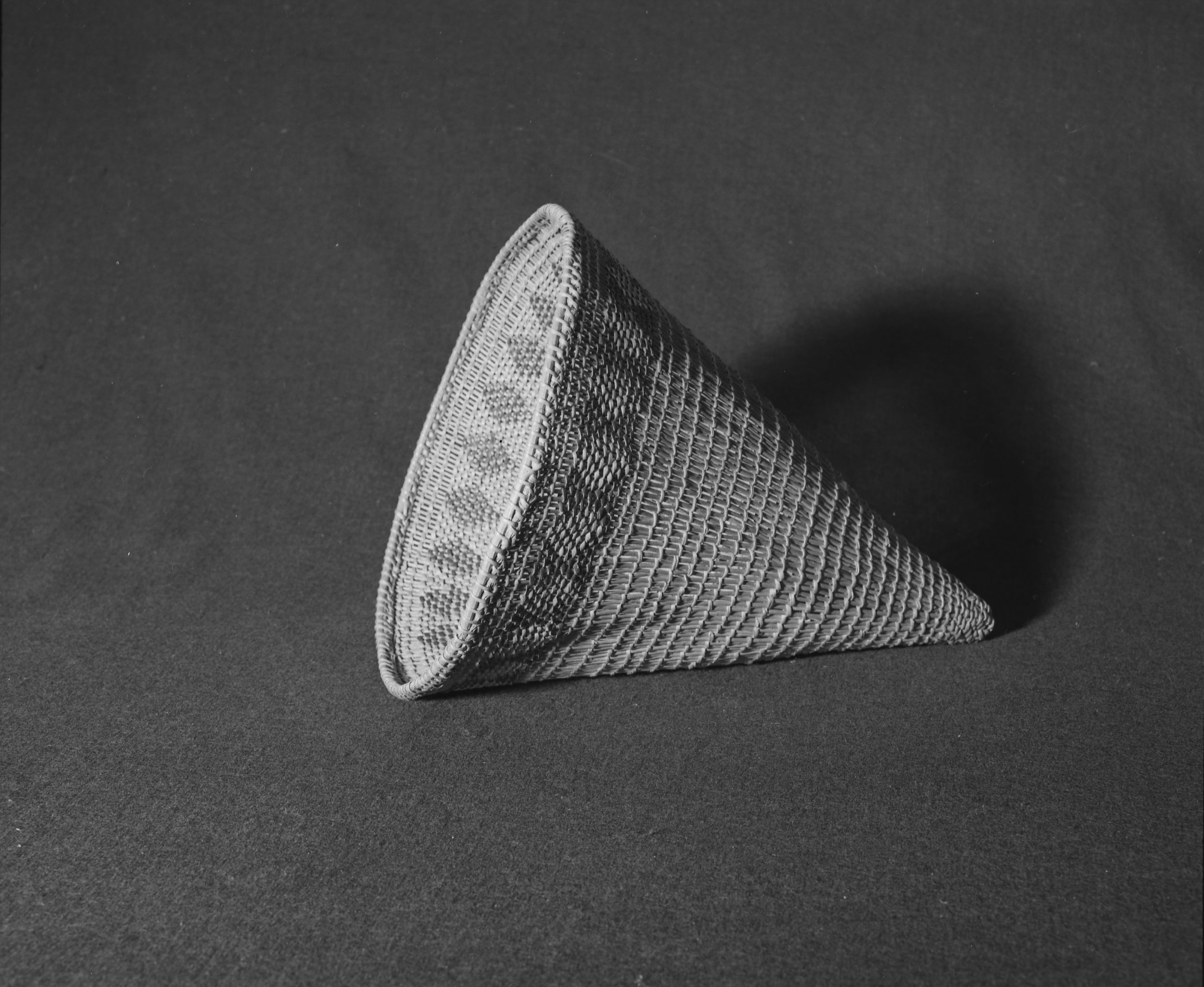 Marie Rozier Collection, Catalog No. 69. Object: Miwok burden basket. Dimensions: 11 x 14". Materials: chaparral sticks, split shoots, split redbud. Technology: diagonal twining, up to right slant of turns. Collection History: Alice Reade Collection. Photographed by Michael Dixon in December 1982. Catalogued by Craig Bates and Barbara Beroza. Yosemite Collections, National Park Service.