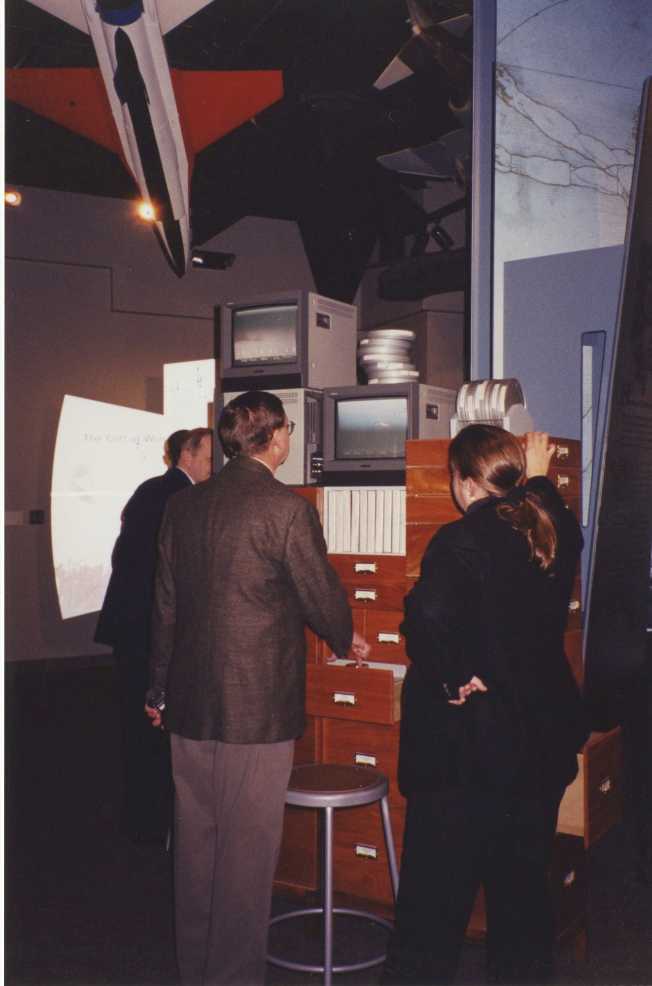 Visitors watching an exhibit video