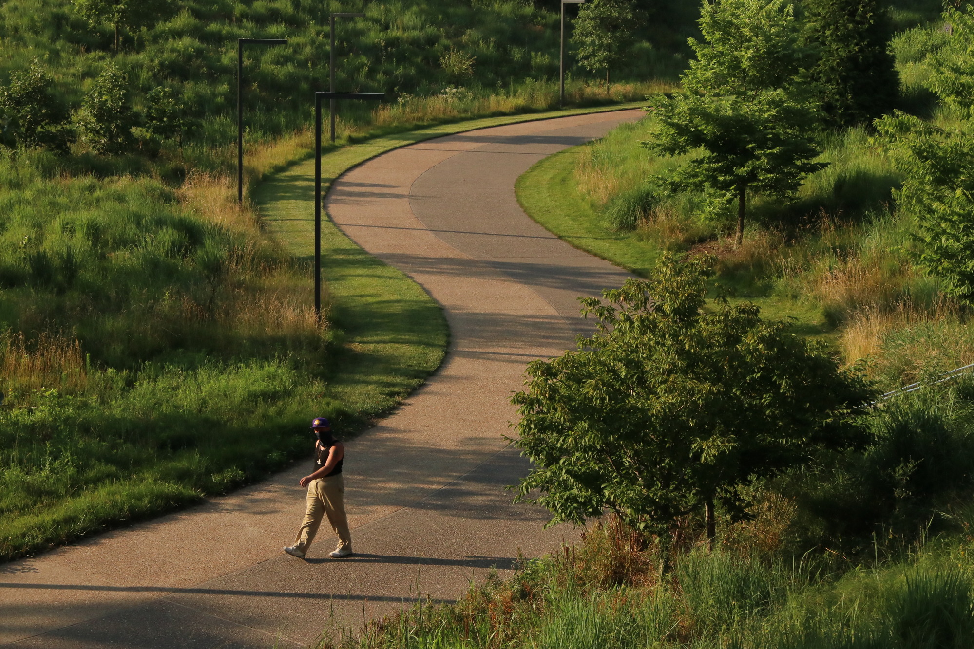 Man walking on Arch grounds