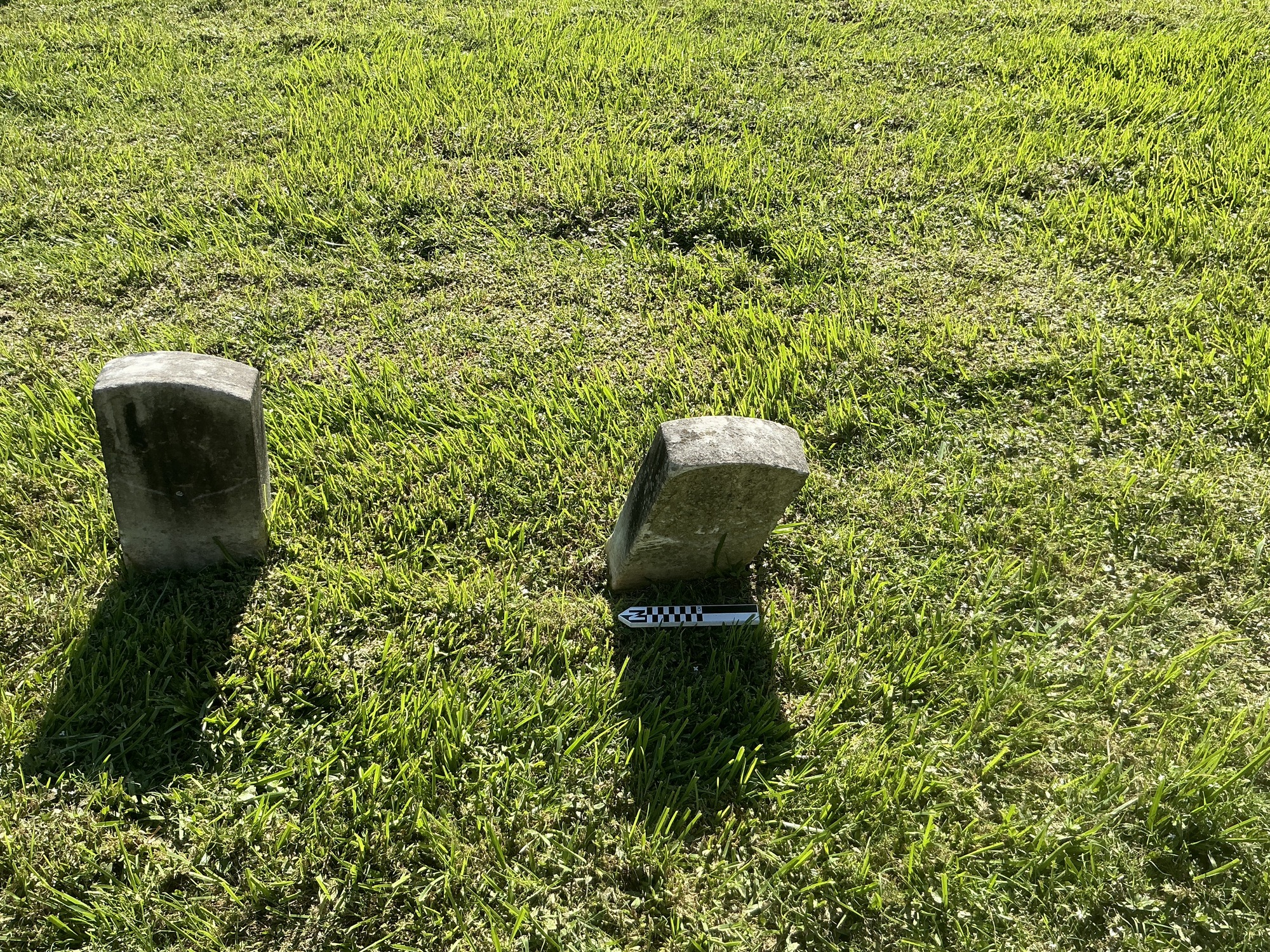 Extra image of historic upright marble headstone with recessed shield face.