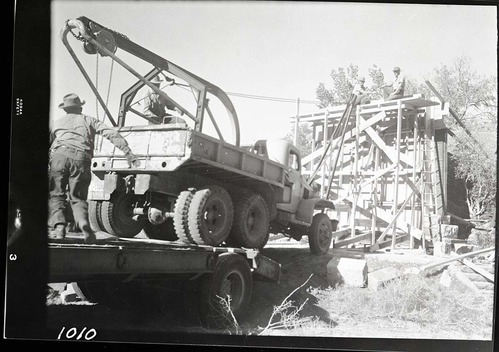 Workers constructing the screen at the South Campground amphitheater.