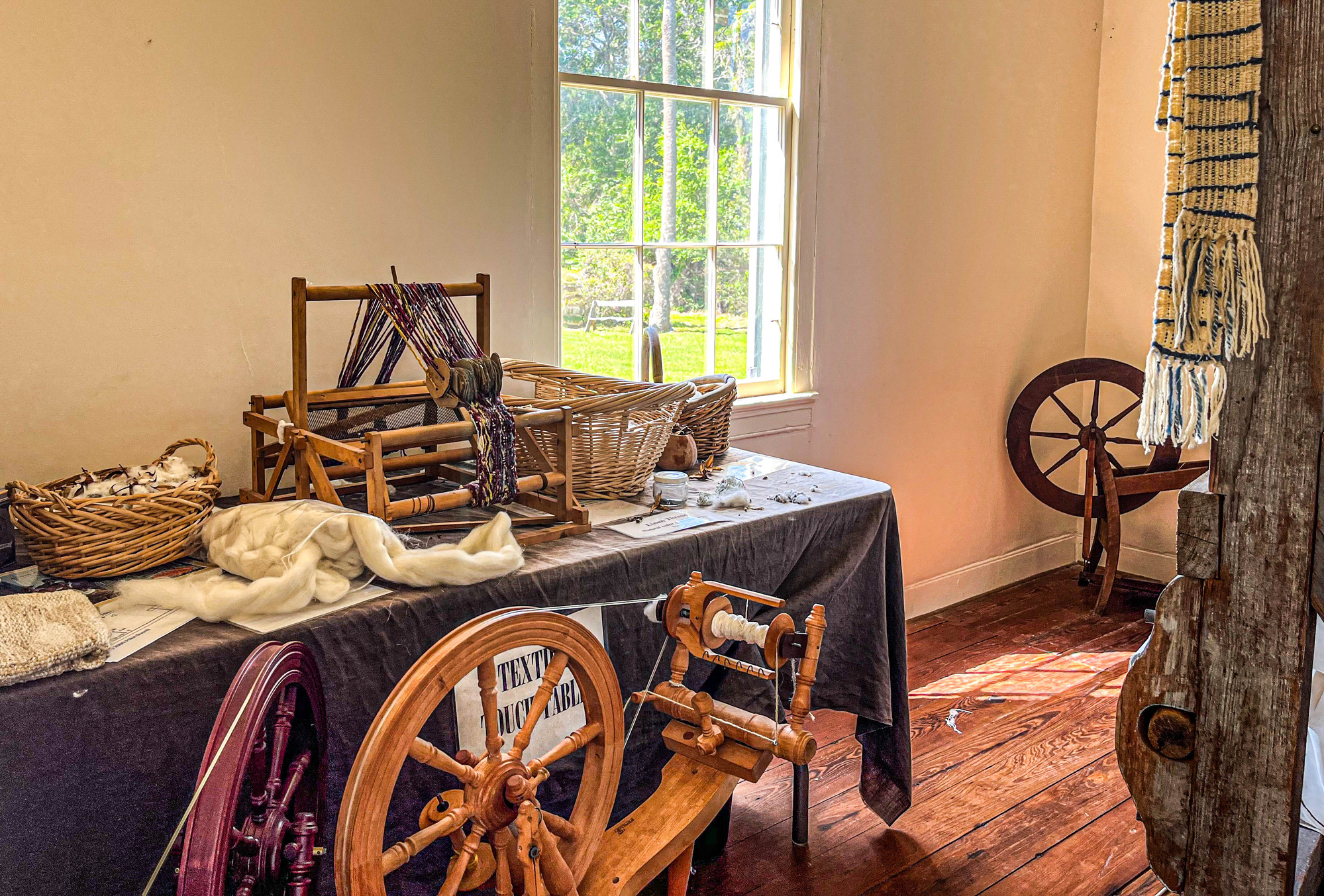 Exhibit space that includes various historical items to process textiles 