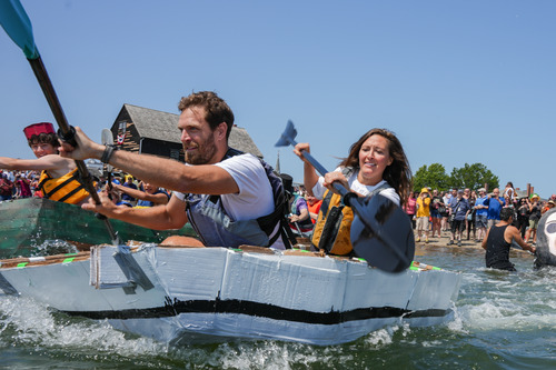 Cardboard boats race in Salem Harbor.