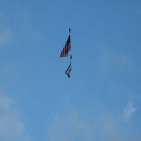 repellers take American and WV flags to top of bridge