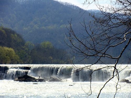 View of a waterfall spanning a wide river