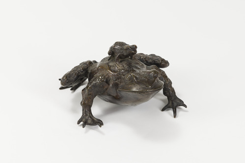 Bronze sculpture of large frog with a small frog on its back.