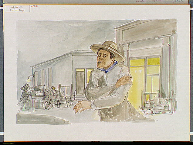 Black man beside station, clutching his arm, watching two other men in the background.