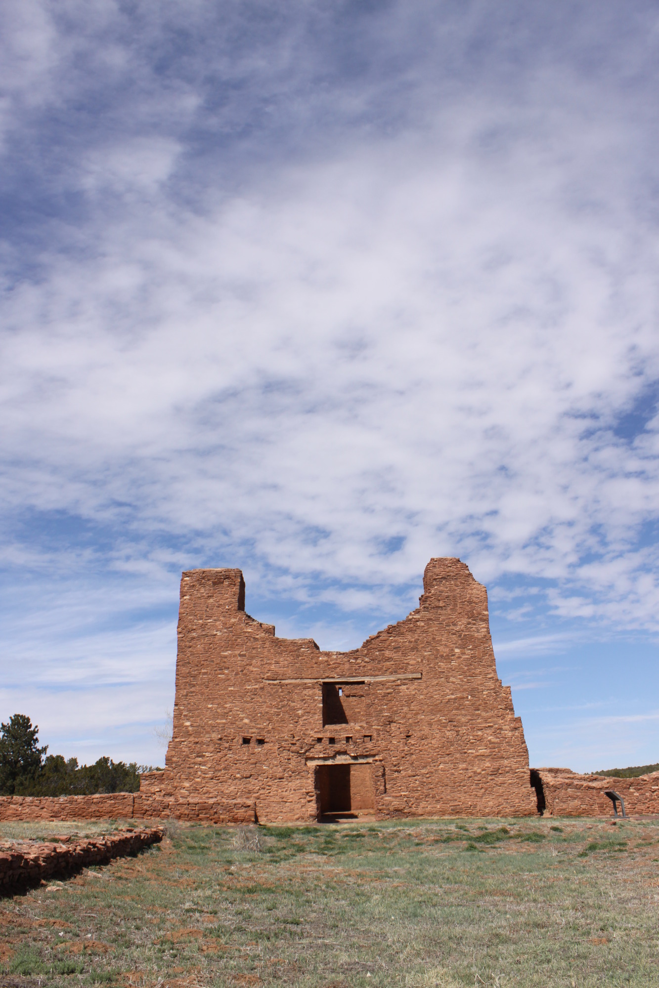 Photograph of Quarai unit pueblo structure, constructed of red sandstone blocks.