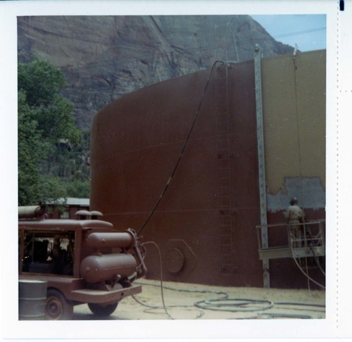 Repainting the exterior of the million gallon water tank at Birch Creek.