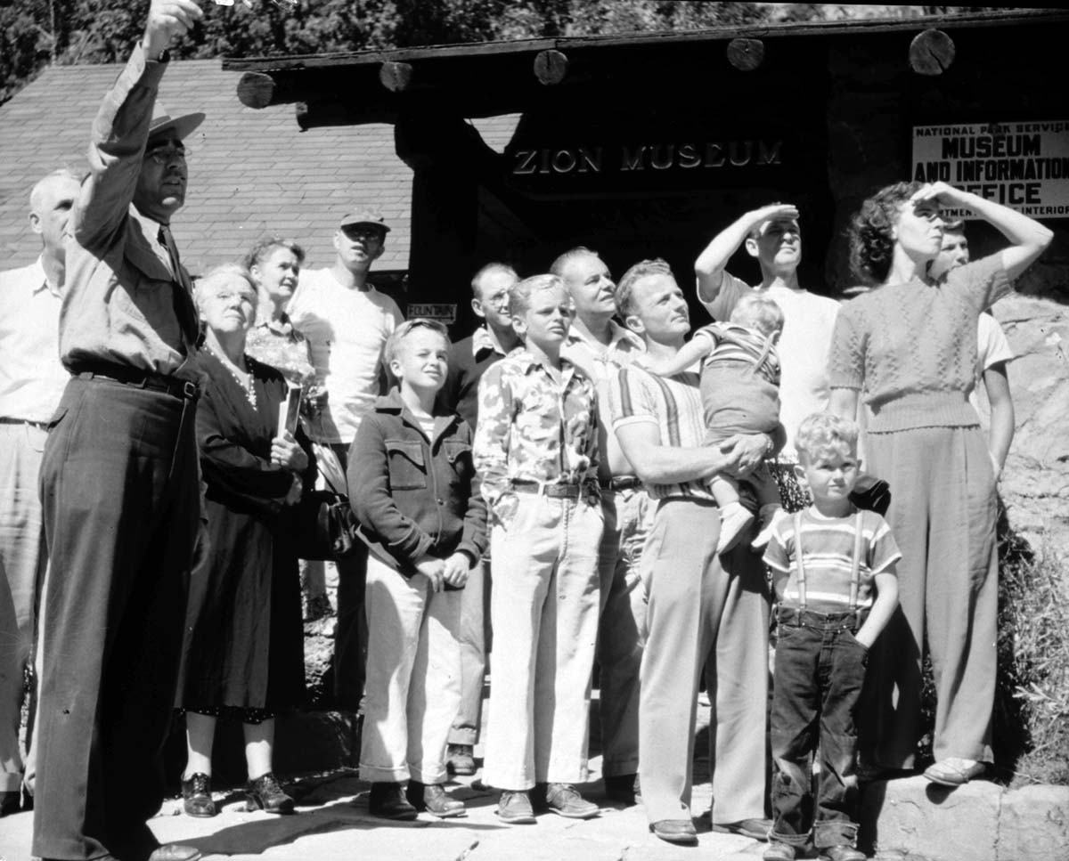 Ranger Naturalist Arthur F. Bruhn pointing out points of interest from museum.