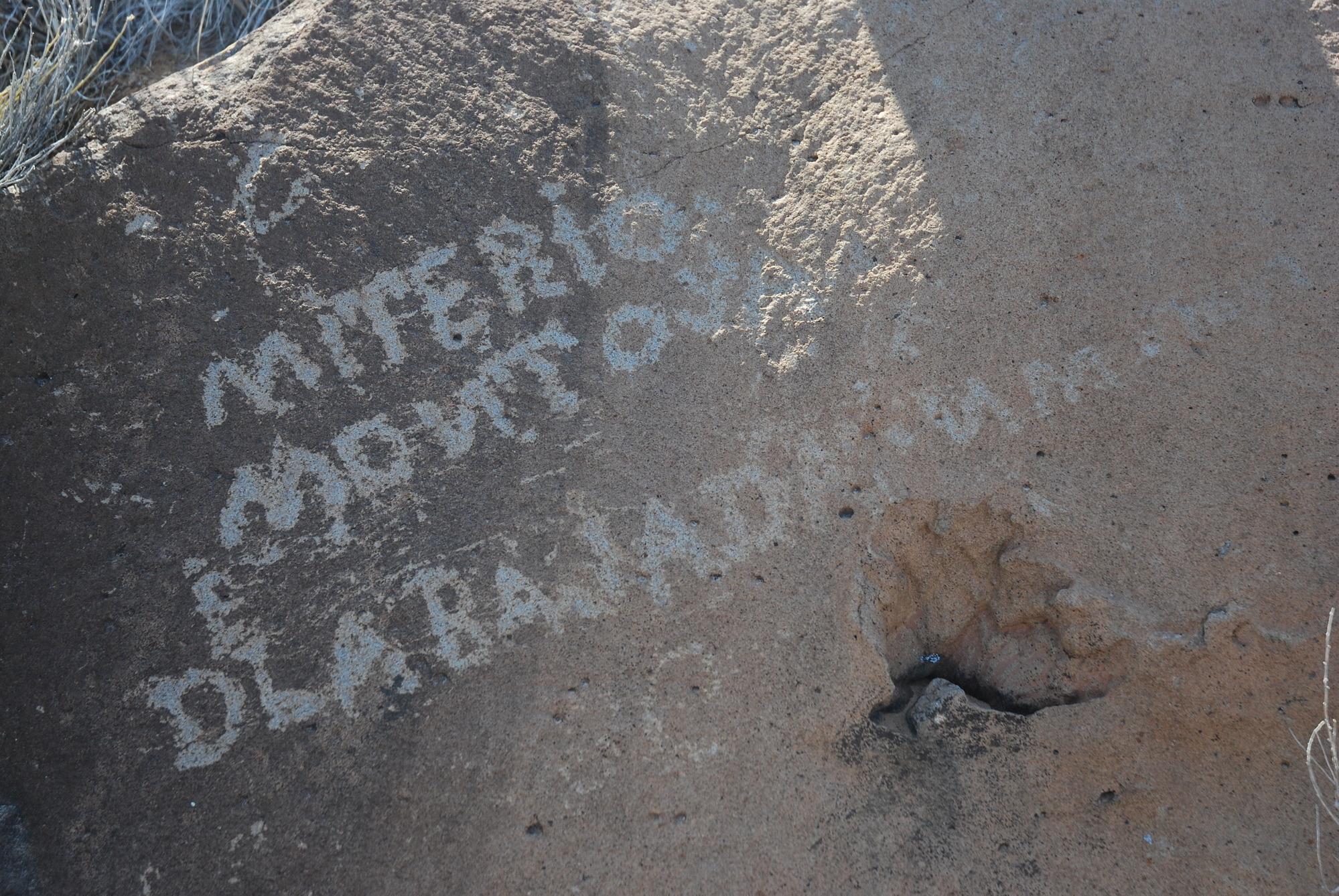 Historic inscriptions are etched on sandstone along the El Camino Real de Tierra Adentro National Historic Trail at La Bajada Mesa near Santa Fe, NM