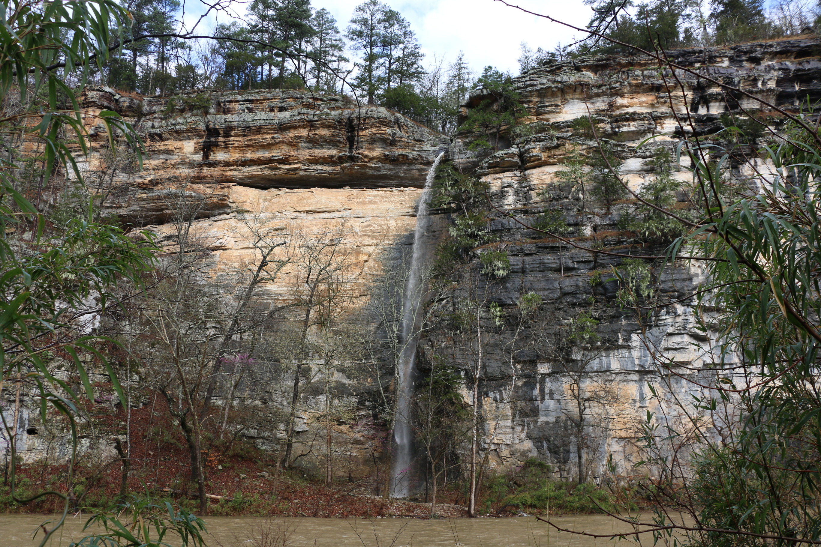 A perennial waterfall pours off of Roark Bluff during a spring flood event