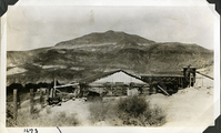 This is an historic black and white photograph from the Scotty's Castle Historic Photograph Collection, Death Valley National Park of Scotty's Castle Stables looking northwest during construction. Circa 1928. Photographed by Mat Roy Thompson.