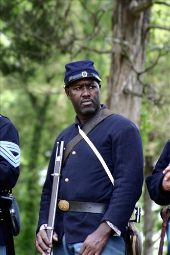 Portaits of Civil War interpreters of U.S. Colored Troops with their rifles at Stones River National Battlefield, April 2004
