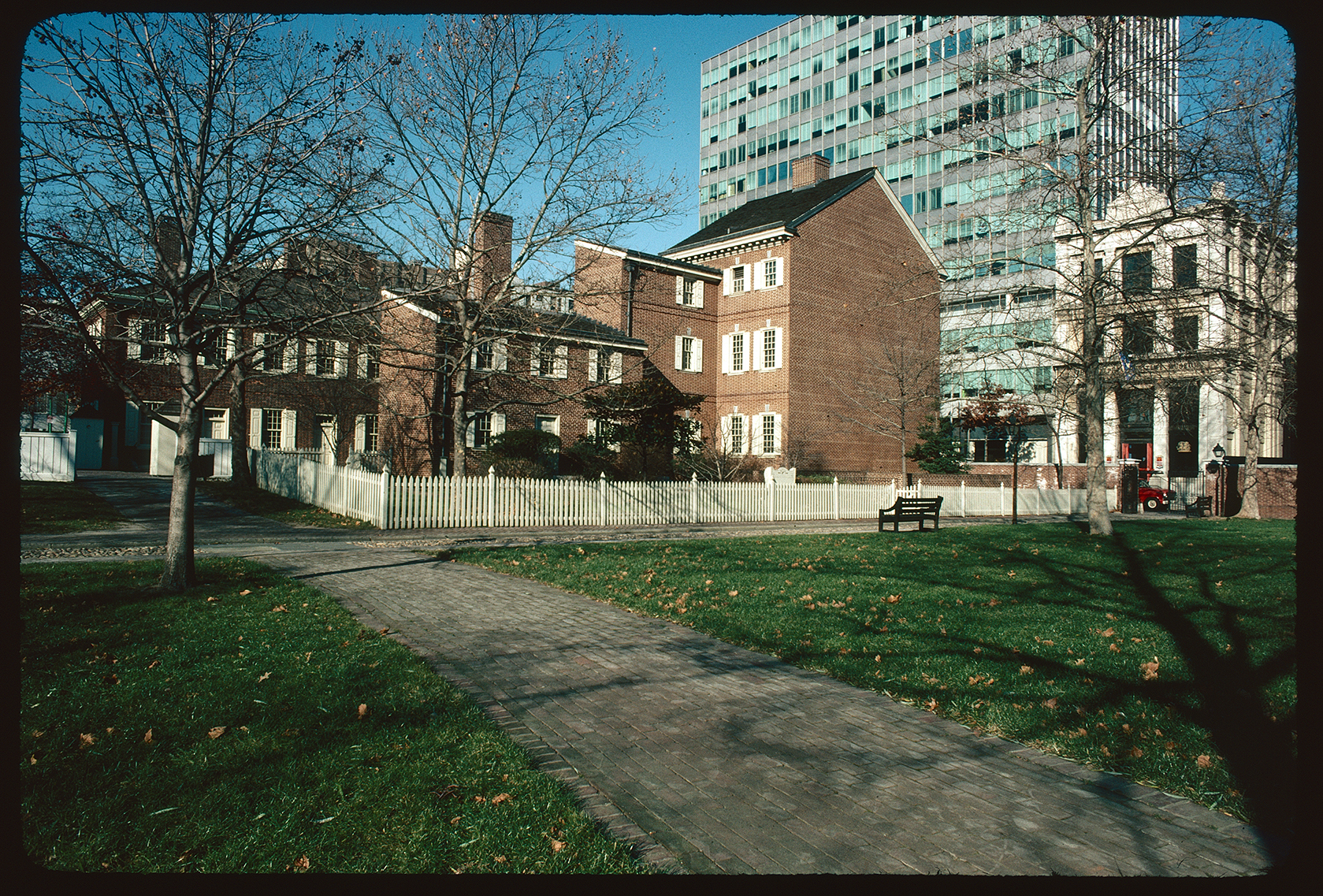 Looking northwest from walkway crossing Hudson's Alley to Carpenters Court. Pemberton House exterior (east side) center background, with New Hall behind it to the left. National Liberty Museum far right.