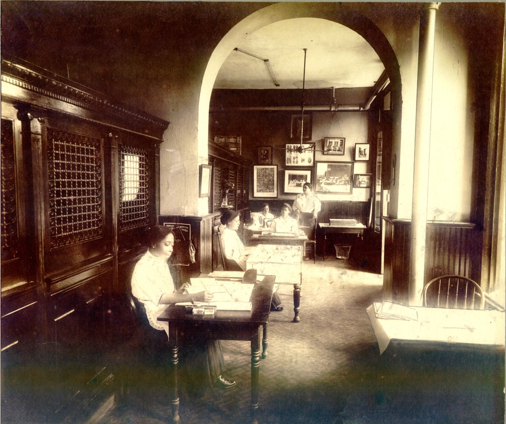 IOSL employees working in supply room at St. Luke Hall.