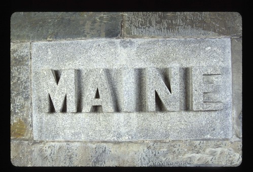 A 2' x 4' commemorative stone that says MAINE on it.