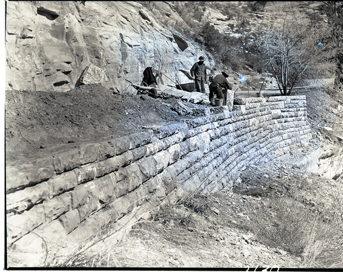 Workers building a retaining wall on park road east of the tunnel, Works Progress Administration (WPA) Civilian Conservation Corps (CCC) project.